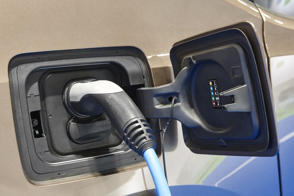 electric cord charging an EV like a Tesla